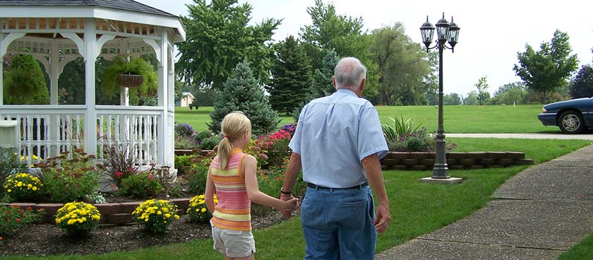 Why Bury Cremated Remains Family Holding Hands Cemetery