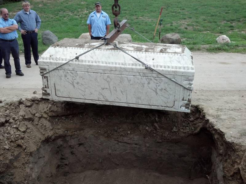 Burial Vault Lifted Out Of Ground After Burial