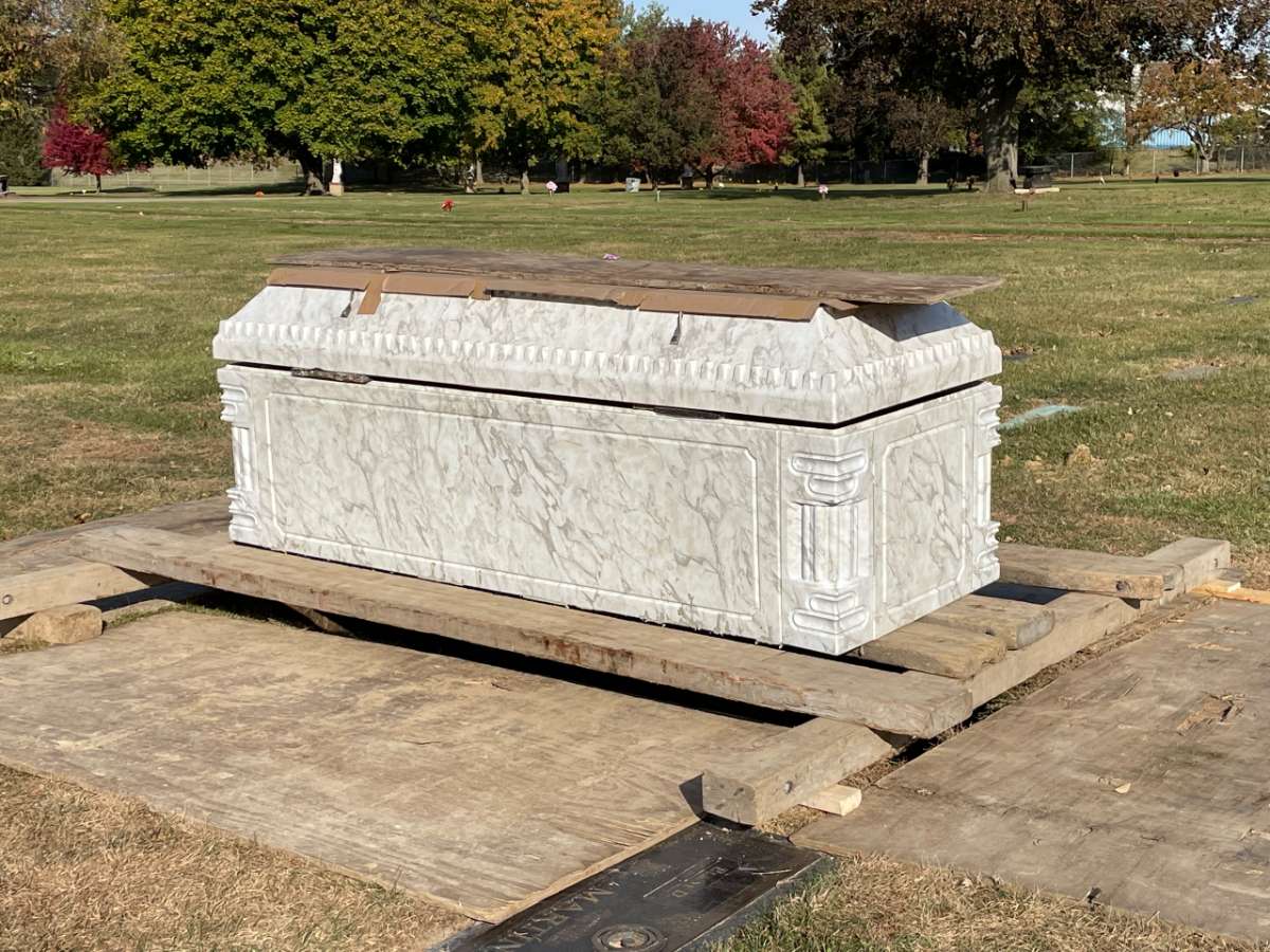 Positioning the burial vault on burial grounds