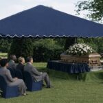 People at a graveside service